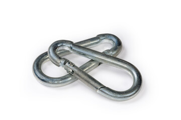 Obraz premium Two small steel snap hooks on a white background
