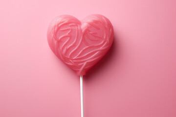 Heart shaped Valentine's Day Pink Lollipop isolated on pink color pastel background using generative AI