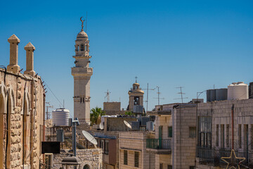 Fototapeta na wymiar Bethlehem cityscape, West Bank, featuring the Minaret of the Mosque of Omar and the Church of the Nativity