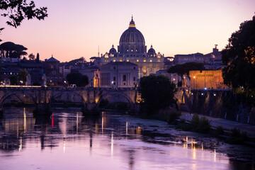 Fototapeta na wymiar Magic view of Rome in the blue hour, with Saint Peter's Basilica in the background
