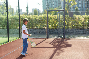 Nice girl with racket in hands playing game of tennis