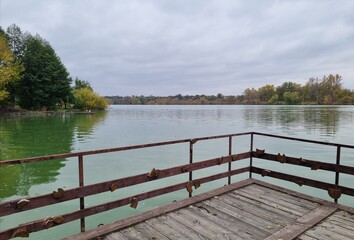 Fototapeta premium Landscape of the forest and lake from the dock.