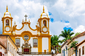 Facade of a historic baroque church and houses in the city of Tiradentes in Minas Gerais