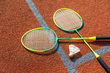 Old badminton rackets and feather shuttlecock