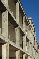 existing reinforced concrete structure of a building under renovation, perspective view with beams and pillars
