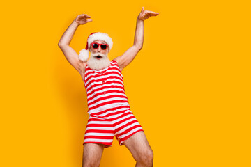 Photo of positive crazy senior guy dressed christmas swimwear enjoying discotheque empty space...