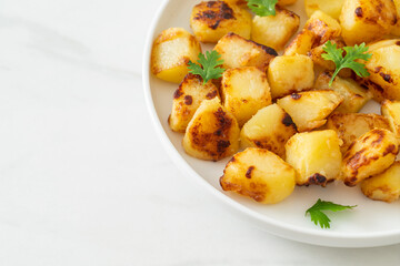 Roasted or grilled potatoes  on plate