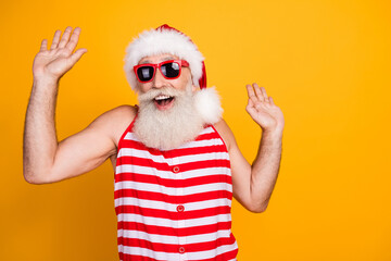Photo of funny impressed elderly guy wear new year swimsuit hat sunglass dancing disco empty space...