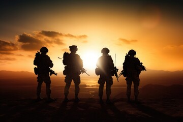A group of soldiers standing on top of a mountain. This image can be used to depict unity, strength, and determination. Suitable for military themes, teamwork, and leadership concepts