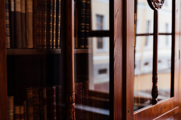 door to the library a shelf with books a reading room