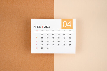 April 2024 calendar page on yellow background.
