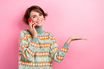 Portrait of happy lady brown bob hair hold arm product offer proposition empty space call phone contact isolated on pink color background - obrazy, fototapety, plakaty