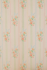 Old wallpaper on the wall. Old wallpaper for texture or background.