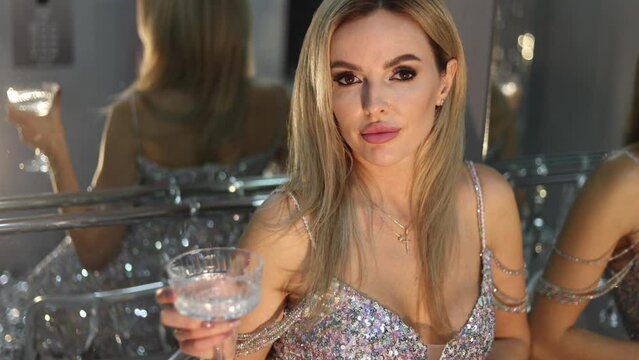 Photo of fancy lady celebrate x mas event clink with champagne on midnight over silver decoration tinsel background