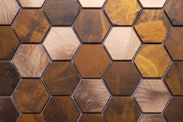 Modern copper mosaic made of seamless tile in hexagon shapes