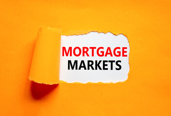 Mortgage markets symbol. Concept words Mortgage markets on beautiful white paper. Beautiful orange paper background. Business mortgage markets concept. Copy space.
