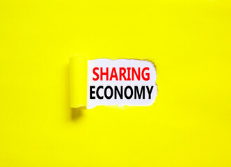 Sharing economy symbol. Concept words Sharing economy on beautiful white paper. Beautiful yellow paper background. Business sharing economy concept. Copy space.