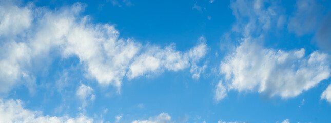 summer blue clouds. gradient light white background . Beautiful clouds in the sunlight. The winter weather is calm and bright.panorama.