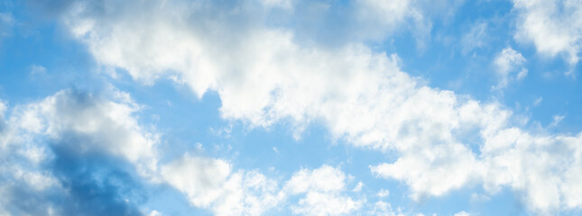 summer blue clouds. gradient light white background . Beautiful clouds in the sunlight. The winter...