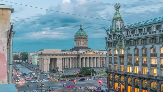 Kazan Cathedral and Singer House from a rooftop, timelapse captures the top view along Griboyedov Canal's waterfront. Traffic flows on the road below. Saint Petersburg, Russia