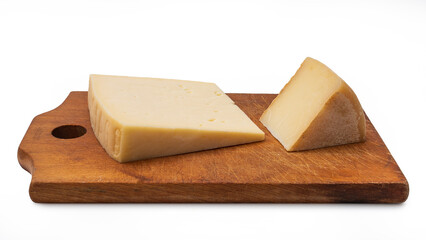 slice of Asiago cheese and Tuscan pecorino on wooden cutting board. isolated white background
