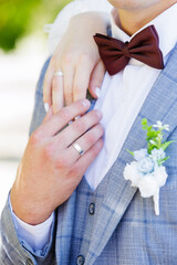 Newlyweds' hands in wedding rings