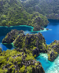 aerial photography of paradisiacal islands of indonesia, philippines tropical vacations with blue water and green jungle - obrazy, fototapety, plakaty