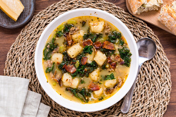 Top down view of Zuppa Toscana soup with cauliflower gnocchi and bacon. 