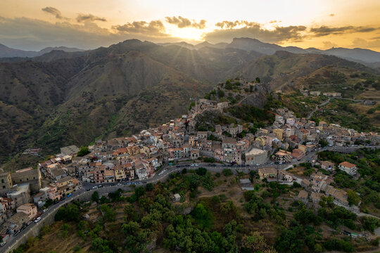 Aerial view of old medieval hilltop town of Forza d'Agro at sunset, Messina, Sicily, Italy