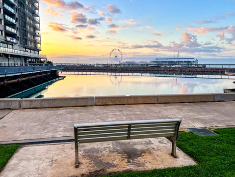 Empty Bench by Darwin Waterfront and Stokes Hill Wharf at sunrise, Darwin, Northern Territory, Australia
