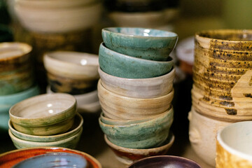 stacks of sets of glazed ceramic bowls