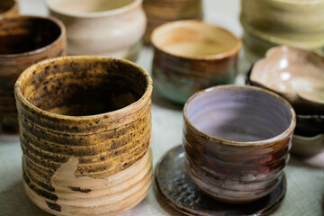 stacks of sets of glazed ceramic bowls