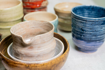 stacks of sets of glazed ceramic bowls