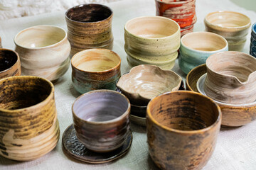 stacks of sets of glazed ceramic bowls
