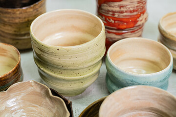 stacks of sets of glazed ceramic bowls