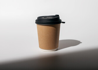Kraft paper cup mockup, coffee mug to go covered with black lid