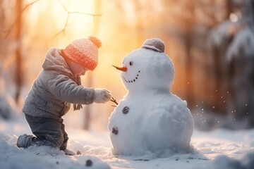 On a cold winter day, a little kid is playing in the snow, building a snowman