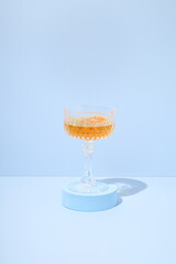 Glass of drink on a blue background.