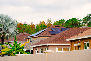 Solar panel on a house roof; Green energy from sun	