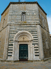 Fototapeta na wymiar Baptistry of San Giovanni adjacent to Volterra cathedral in Italy