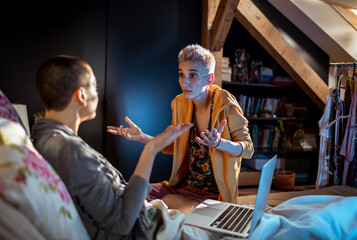 Young female couple arguing in the bedroom