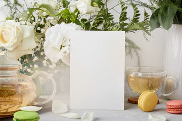  Stationery card template for greetings, invitation, text, white flowers, macaroons and tea. Copy space.