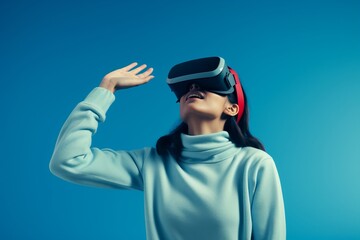 woman wearing  vr glasses looking upin plain background