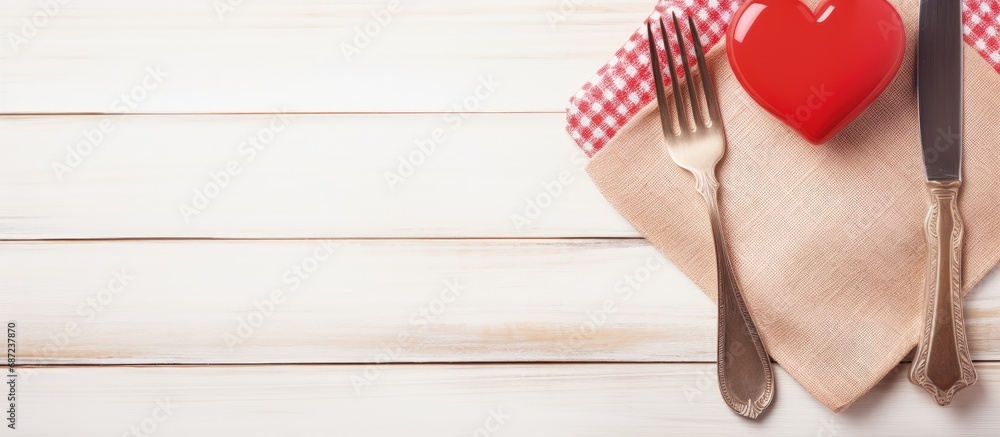 Poster valentine s day dinner scene with cutlery heart and space for text on a white wooden table copy spac
