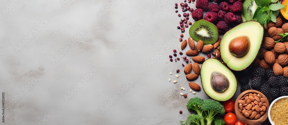 Poster Superfoods on a gray background with room for text Nuts beans greens fruit and seeds Nutritious vegan cuisine Copy space image Place for adding text or design