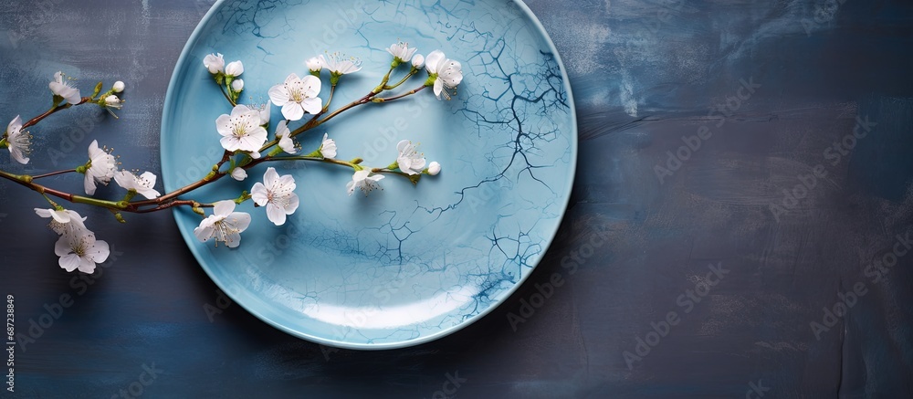 Poster spring branches decorate handmade ceramic plates close up of blue vintage dishes on grey background 