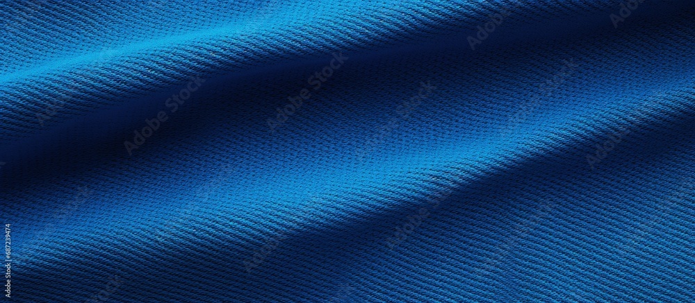 Poster texture of football jersey fabric in blue with stitched details copy space image place for adding te