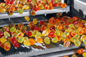 Production of color jelly fruit on conveyor line of plant. Food industry marmalade
