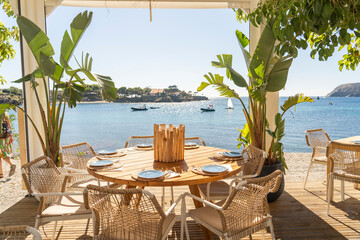 restaurant with a table overlooking the sea, on the Costa Brava on a summer day