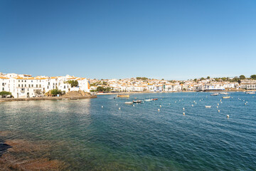 Fototapeta na wymiar city ​​landscape on the costa brava in summer with white houses and boats